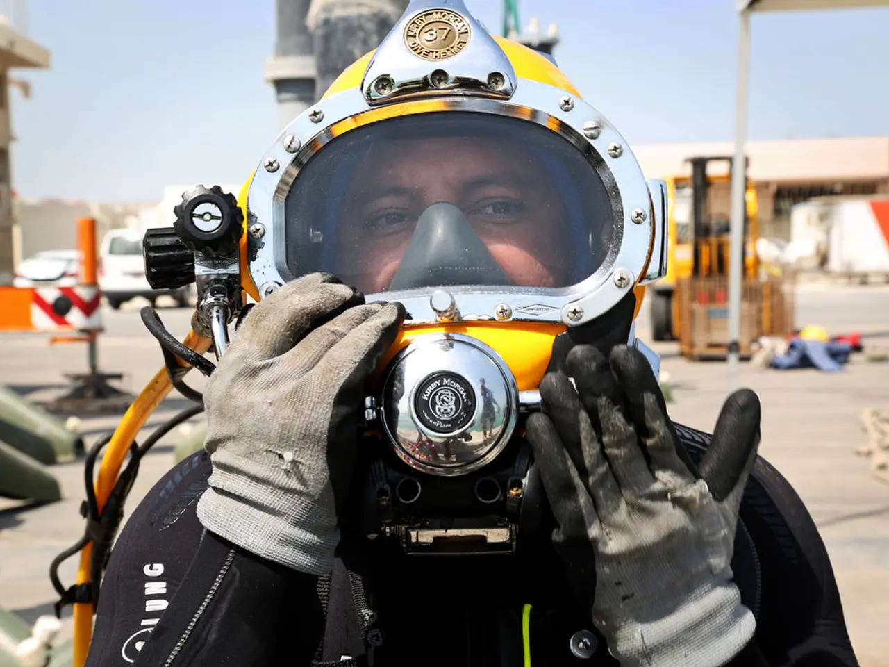 In this image, we can see a person wearing gloves and firefighters helmet. In the background, we...