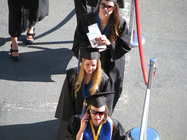 In this picture there are few women wearing graduation dress which is in black color.