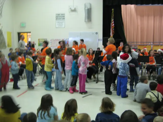 At the bottom of this image, there are children in different color dresses, sitting. In the...